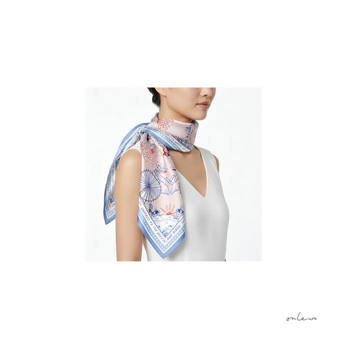 Onlewo 'Downtown' silk scarf styled — elegant Singapore city landmarks pattern, 100% mulberry silk, Singapore-designed corporate gift by Onlewo