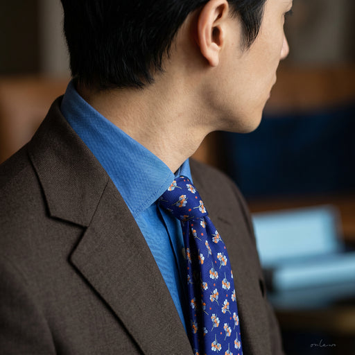 Onlewo 'Singapore Orchid - Vanda Miss Joaquim' silk tie styled — elegant orchid pattern on 100% silk, 7cm width, designed in Singapore by Onlewo